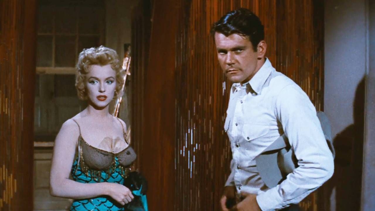 Marilyn Monroe and Don Murray enter